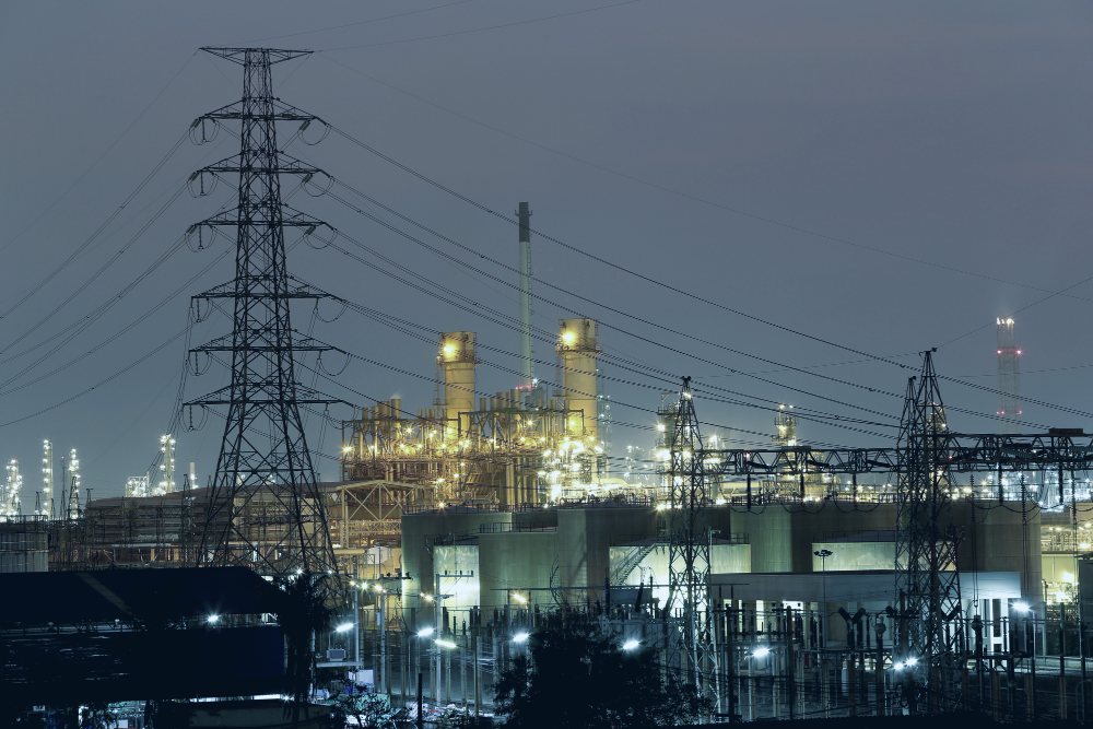 Power generation plant lit at dusk